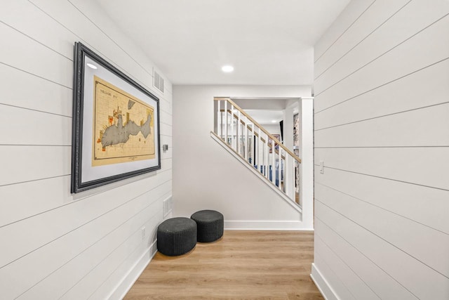 corridor with light wood-type flooring