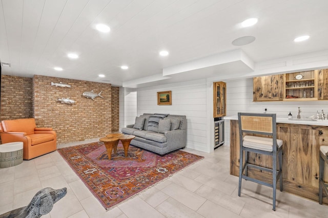 living room with wet bar, light tile patterned floors, and wine cooler