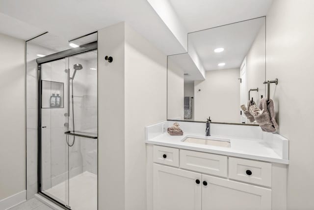 bathroom with vanity and an enclosed shower