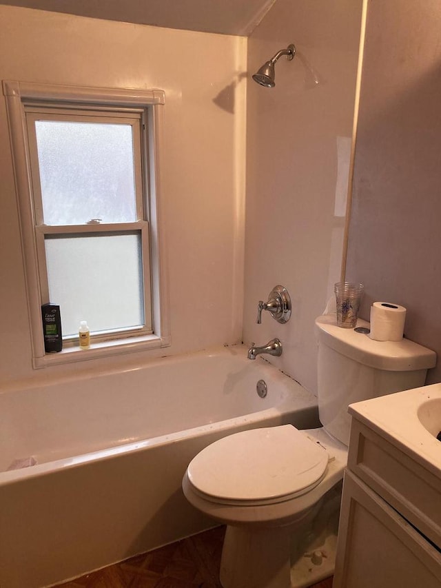 full bathroom with bathing tub / shower combination, vanity, and toilet