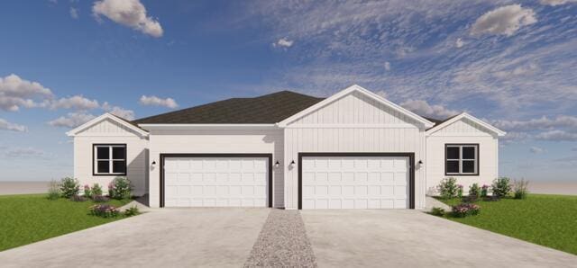 ranch-style home featuring a garage and a front lawn