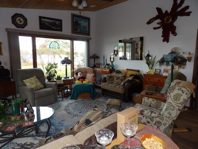 living room with hardwood / wood-style floors, ceiling fan, wooden ceiling, and vaulted ceiling