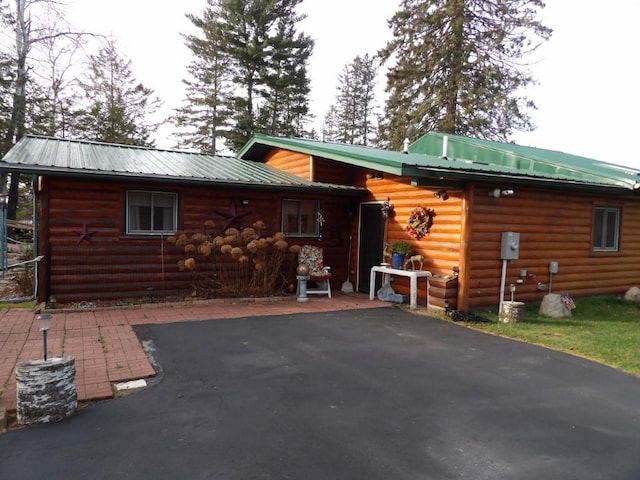 back of property featuring a patio area