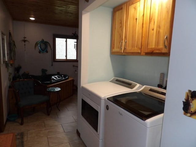 laundry room with cabinets, independent washer and dryer, and wood ceiling