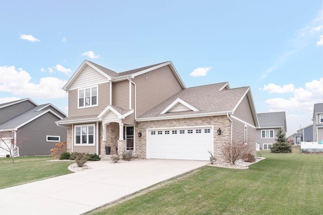 9907 White Fox Ln, Middleton, WI 53562 - view of front of house featuring a garage, driveway, stone siding, and a front yard