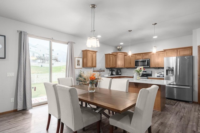 dining room featuring sink and hardwood / wood-style flooring