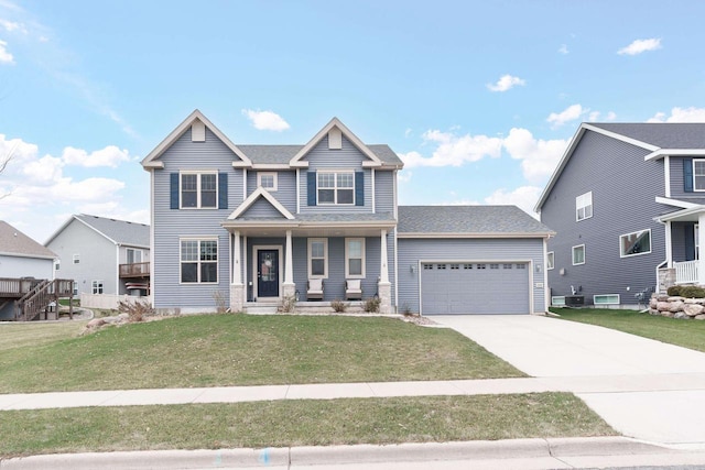 view of front of house featuring a front yard and a garage