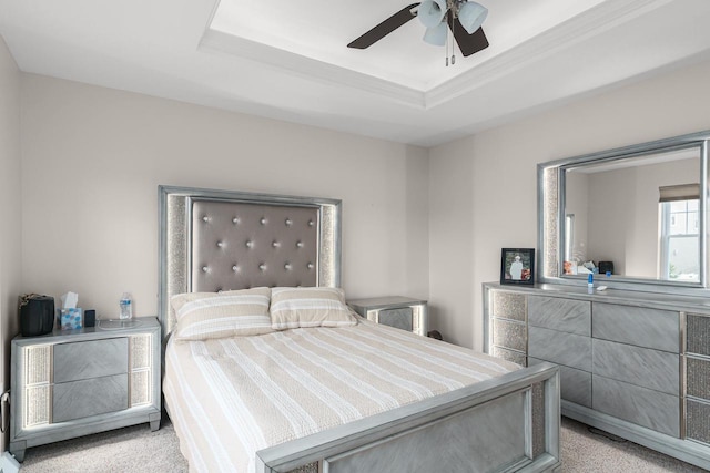 9907 White Fox Ln, Middleton, WI 53562 - bedroom featuring ceiling fan, a tray ceiling, and light colored carpet