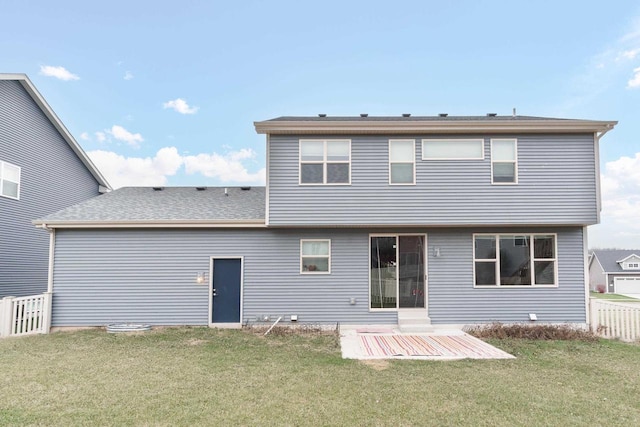 rear view of house with a patio area and a yard