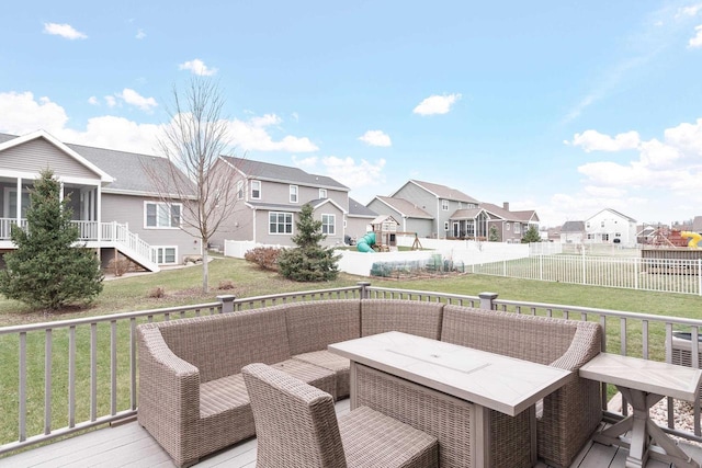 wooden deck with a sunroom and a yard