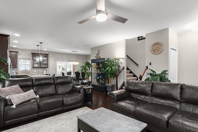 9907 White Fox Ln, Middleton, WI 53562 - living room with ceiling fan, stairs, dark wood-style floors, recessed lighting, and a chandelier