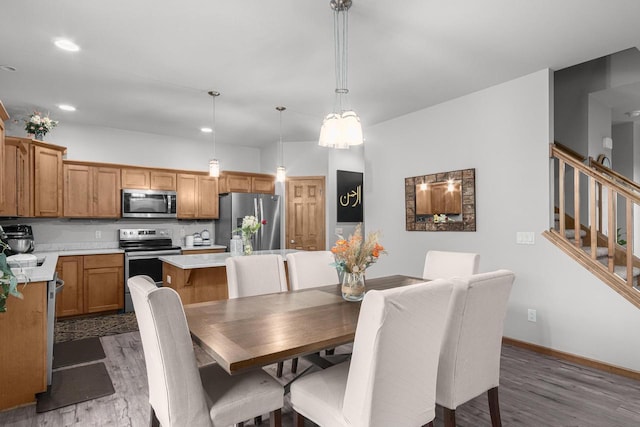 dining space featuring dark hardwood / wood-style floors