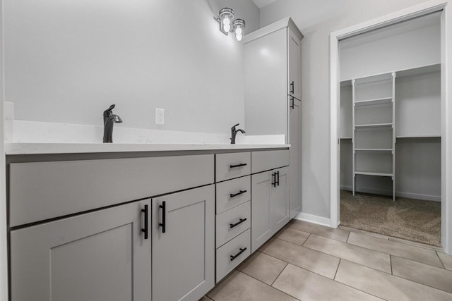 bathroom featuring tile patterned flooring and vanity