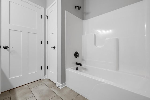 bathroom featuring tile patterned flooring and bathtub / shower combination