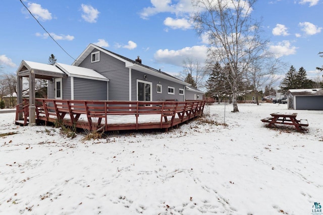 121 E Bayfield St, Washburn, WI 54891 - snow covered property with a wooden deck