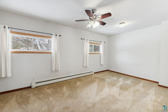 121 E Bayfield St, Washburn, WI 54891 - carpeted empty room featuring ceiling fan and a baseboard heating unit