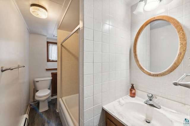 121 E Bayfield St, Washburn, WI 54891 - bathroom with vanity, hardwood / wood-style flooring, toilet, and tile walls