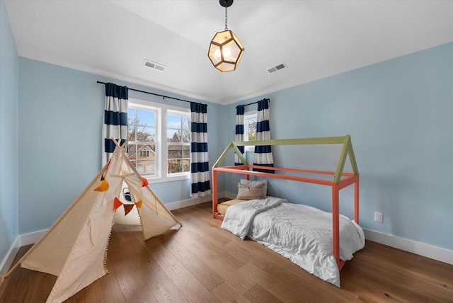 bedroom featuring wood-type flooring