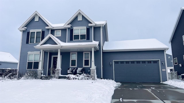 view of front facade featuring covered porch and a garage