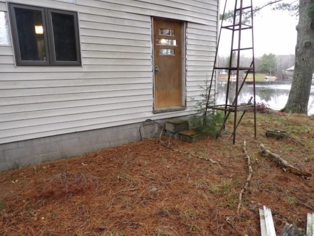 property entrance featuring a water view