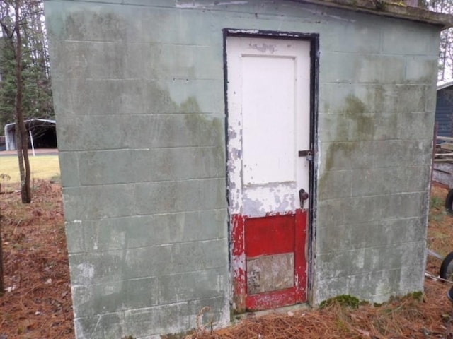 view of storm shelter with a storage shed