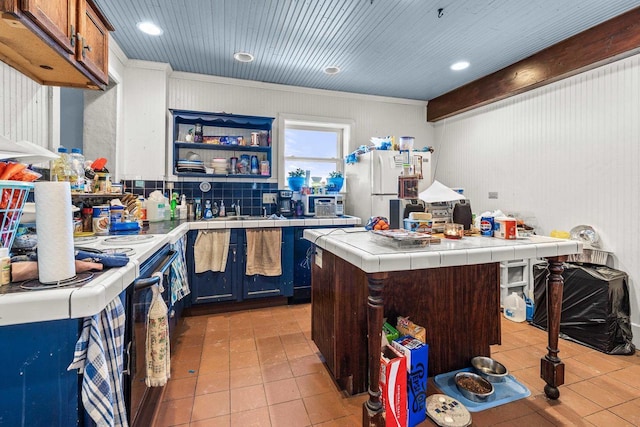 kitchen with tile countertops, a kitchen island, white appliances, and crown molding