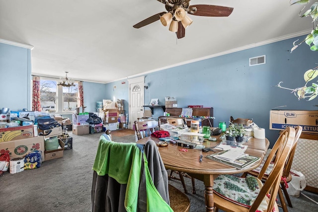 carpeted dining area featuring crown molding and ceiling fan with notable chandelier