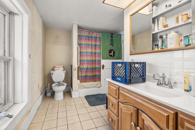 bathroom featuring vanity, a shower with curtain, tile patterned flooring, decorative backsplash, and toilet