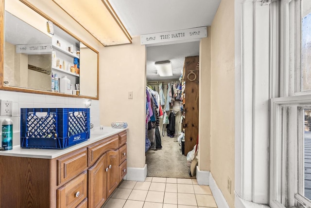 bathroom with tile patterned flooring and vanity