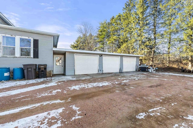 view of snow covered garage