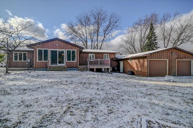 view of snow covered back of property