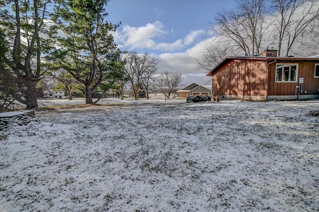 view of yard layered in snow