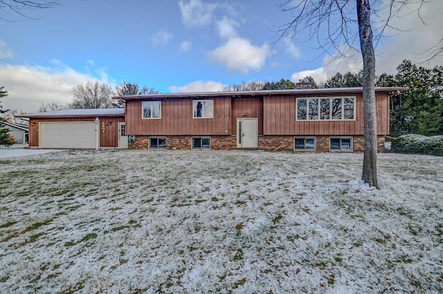 raised ranch featuring a garage