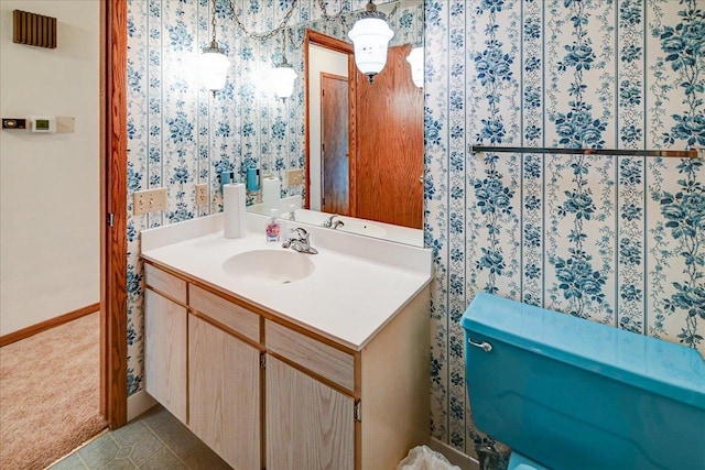 bathroom featuring tile patterned flooring and vanity