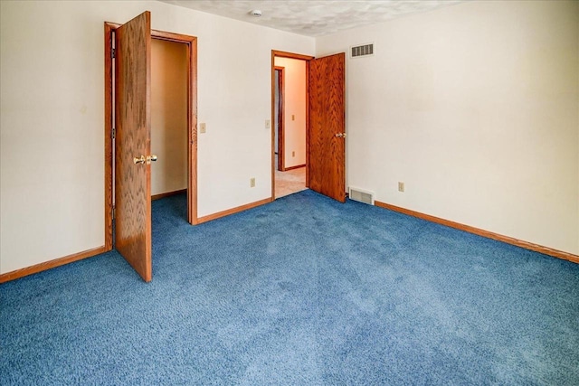 unfurnished bedroom with carpet flooring