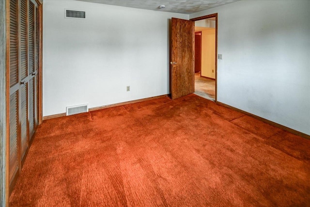 empty room featuring carpet flooring