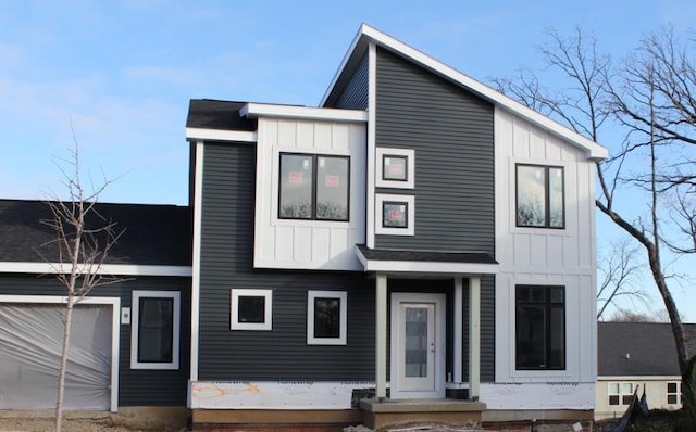 view of front of home featuring an attached garage and board and batten siding