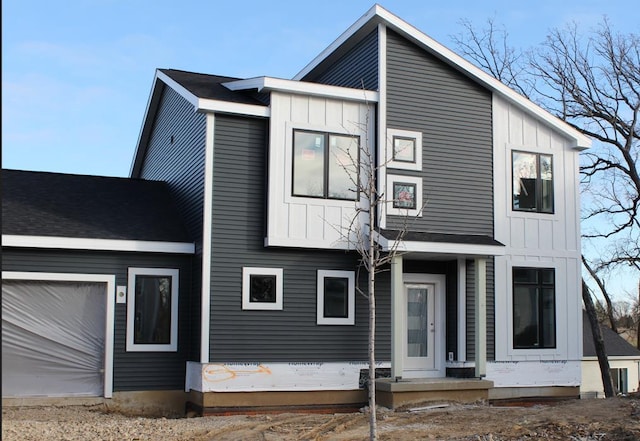 view of front facade featuring a garage and board and batten siding