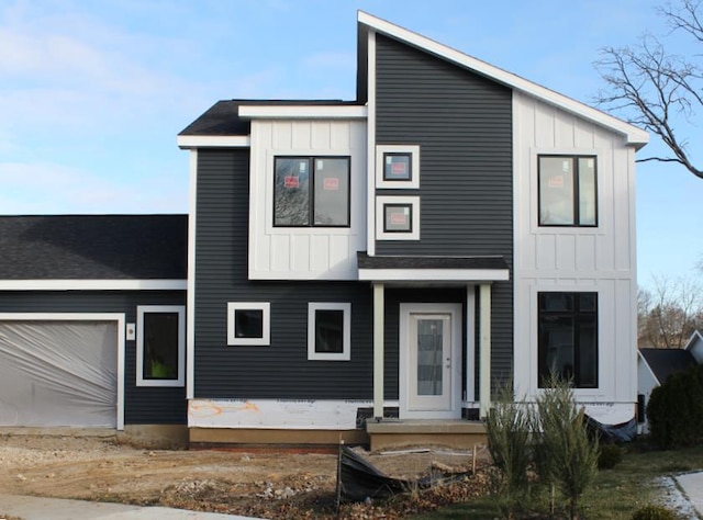 view of front of home with board and batten siding and an attached garage