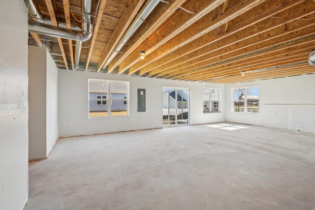 interior space featuring electric panel and concrete floors