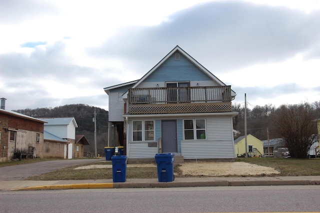 view of front of property with a balcony