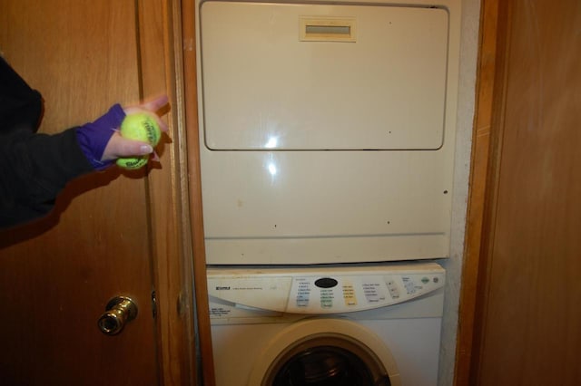 washroom with stacked washer / dryer