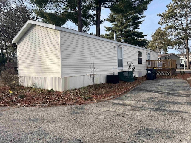 view of side of home featuring a deck