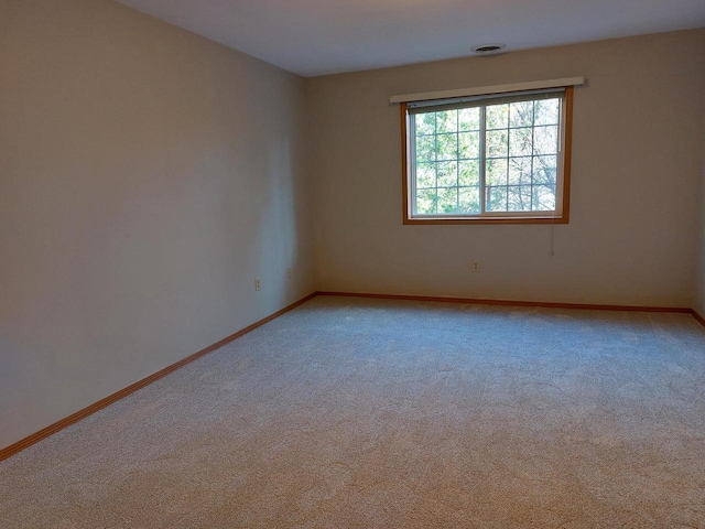 unfurnished room featuring carpet floors