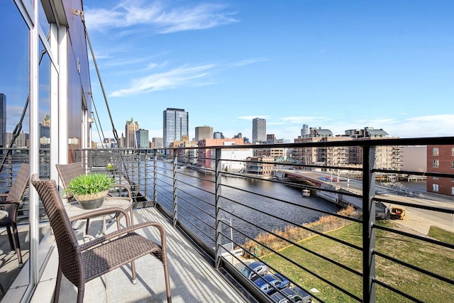 balcony featuring a water view