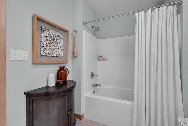 bathroom featuring tile patterned floors and shower / bath combo