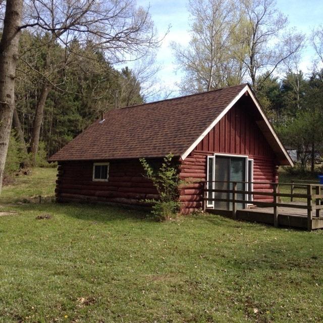 view of outbuilding with a yard