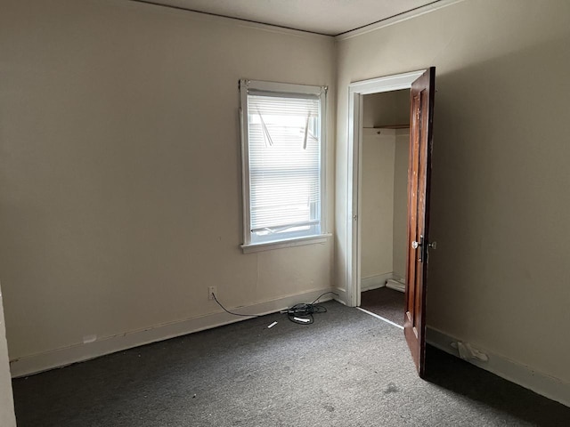 carpeted empty room with a wealth of natural light