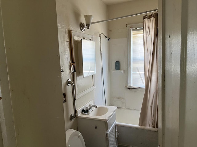 full bathroom with vanity, plenty of natural light, and shower / bath combo with shower curtain