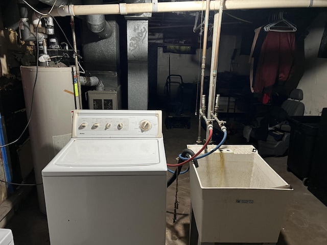 clothes washing area with gas water heater and washer / clothes dryer